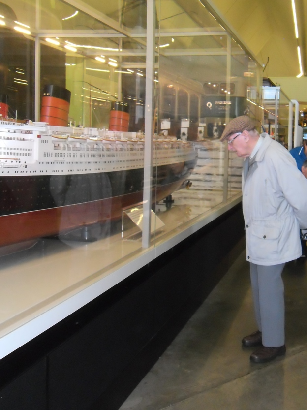 robert looking at the detail on the model ship.JPG